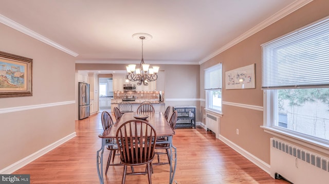 107 S Dover Ave, Atlantic City, NJ 08401 - dining room with an inviting chandelier, radiator, and light wood-style floors