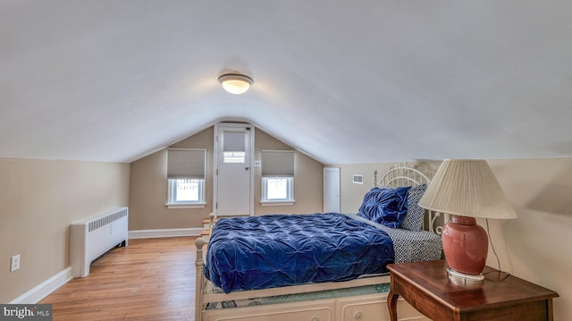 107 S Dover Ave, Atlantic City, NJ 08401 - bedroom with visible vents, baseboards, light wood finished floors, lofted ceiling, and radiator