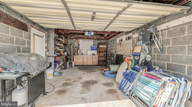 107 S Dover Ave, Atlantic City, NJ 08401 - garage with concrete block wall and a garage door opener
