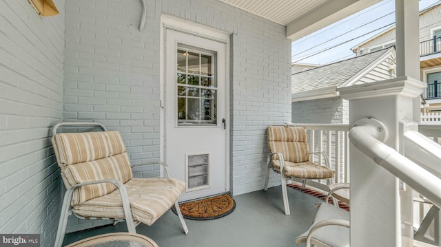 107 S Dover Ave, Atlantic City, NJ 08401 - view of exterior entry featuring brick siding and a balcony