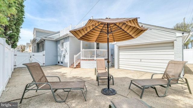 107 S Dover Ave, Atlantic City, NJ 08401 - view of patio with a fenced backyard, a gate, and a garage