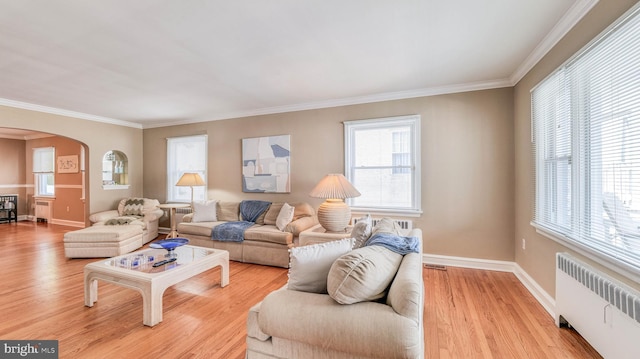 107 S Dover Ave, Atlantic City, NJ 08401 - living room with arched walkways, radiator, light wood-style flooring, and ornamental molding