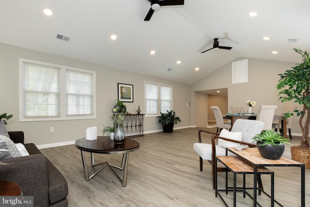 living room with recessed lighting, ceiling fan, visible vents, and vaulted ceiling