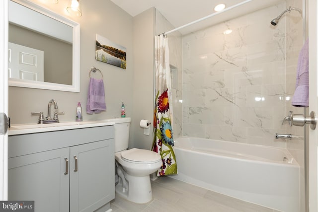 full bath with vanity, tile patterned floors, shower / bath combination with curtain, and toilet