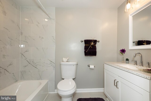 bathroom with toilet, baseboards, shower / bathing tub combination, and vanity