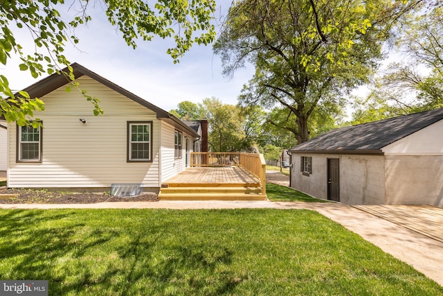 exterior space featuring a lawn and a wooden deck