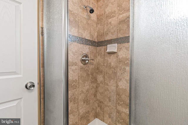 bathroom featuring a stall shower