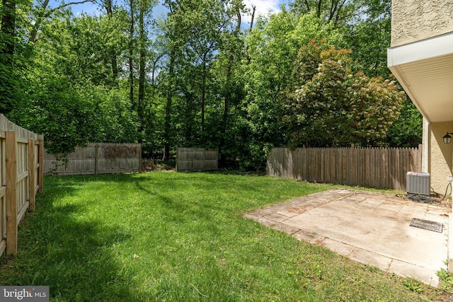 view of yard with a patio and central AC