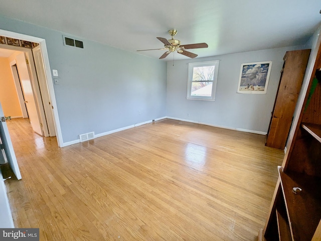 interior space with visible vents, baseboards, and light wood-style floors