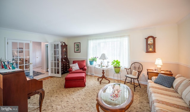 living area featuring crown molding and french doors