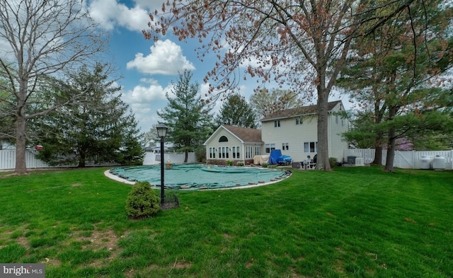 exterior space featuring a yard, a fenced in pool, and fence private yard