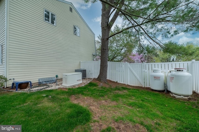 view of yard with fence and a gate