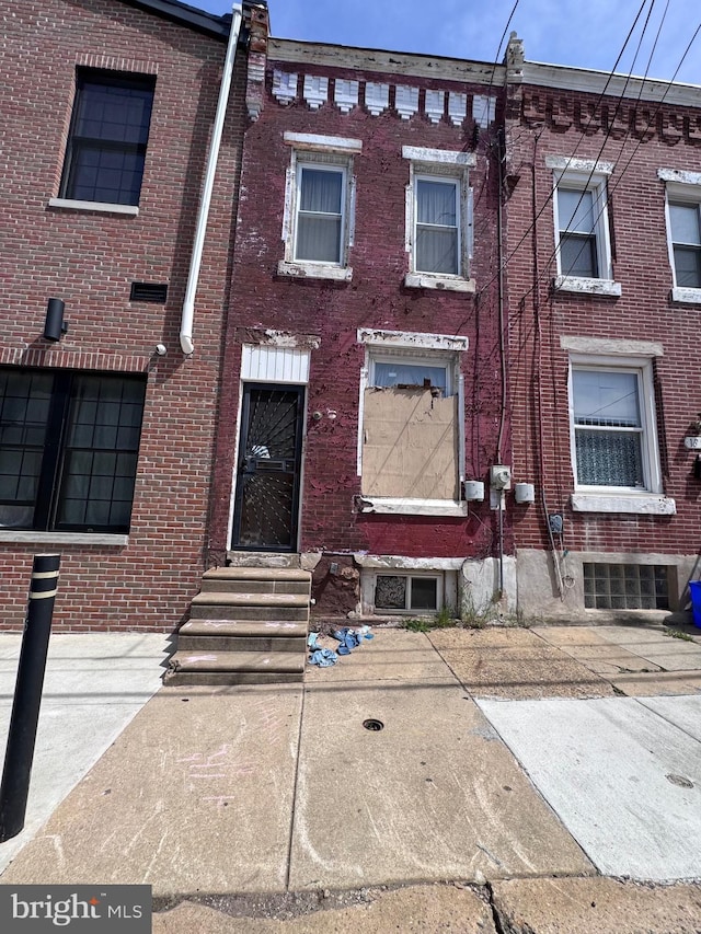 1835 N Gratz St, Philadelphia, PA 19121 - view of property with brick siding and entry steps
