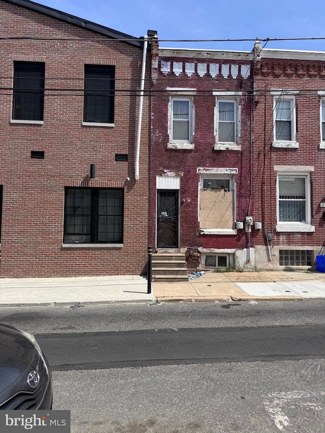 1835 N Gratz St, Philadelphia, PA 19121 - view of property featuring brick siding and entry steps