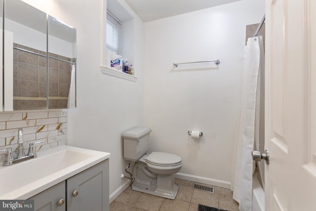 bathroom with toilet, baseboards, tile patterned flooring, vanity, and backsplash