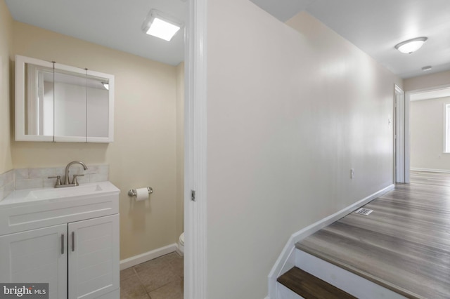 stairway featuring baseboards
