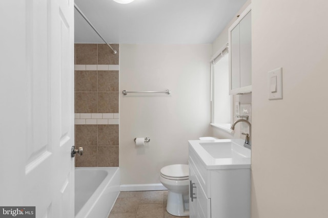 full bath with vanity, toilet, baseboards, tile patterned floors, and shower / washtub combination