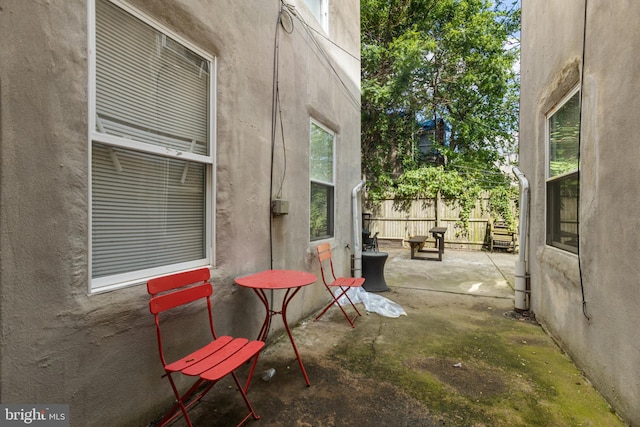 view of patio featuring fence