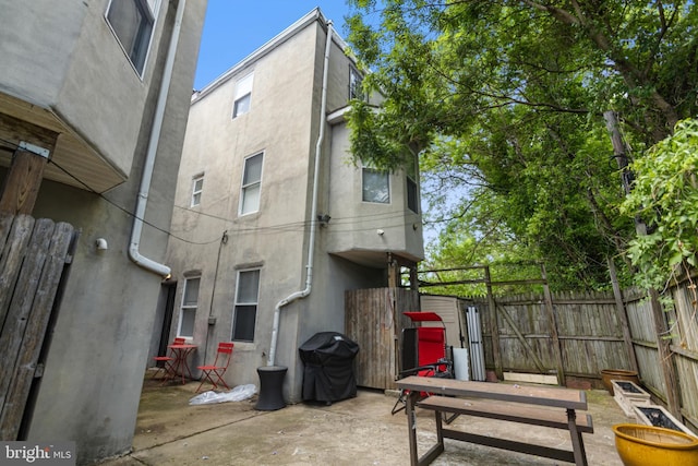 view of patio / terrace featuring fence