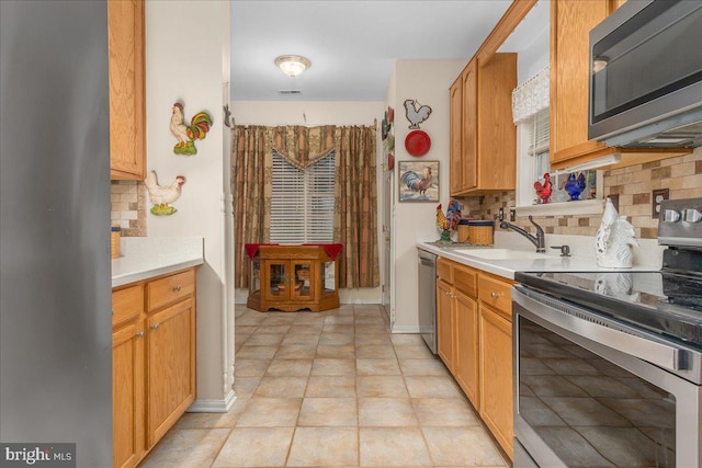 93 Radcliff Ln, Falling Waters, WV 25419 - kitchen featuring tasteful backsplash, appliances with stainless steel finishes, light countertops, a sink, and visible vents