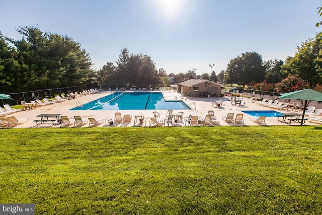 93 Radcliff Ln, Falling Waters, WV 25419 - community pool with a lawn, fence, and a patio area