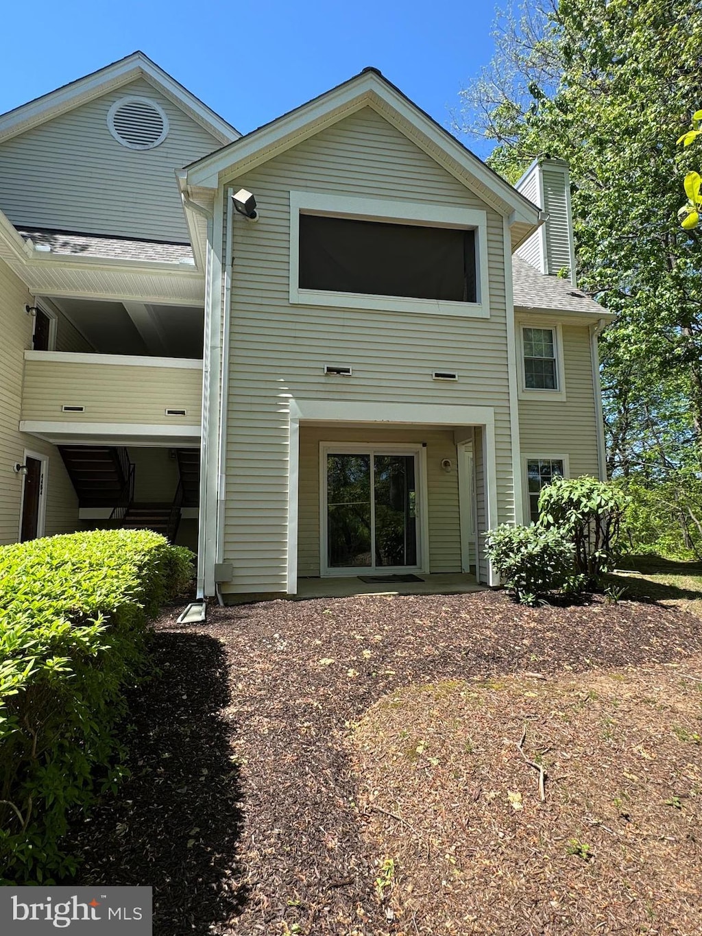 4466 Lord Loudoun Ct Unit 15-3, Upper Marlboro, MD 20772 - rear view of property with roof with shingles and a chimney