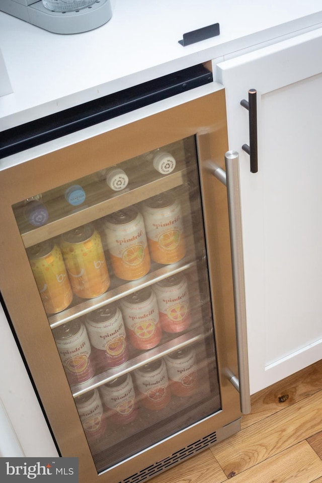 room details with fridge and wood finished floors