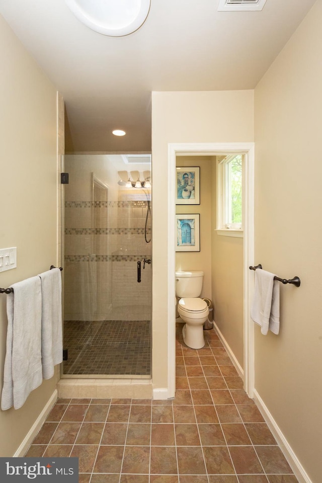 full bathroom with visible vents, toilet, baseboards, tile patterned floors, and a stall shower