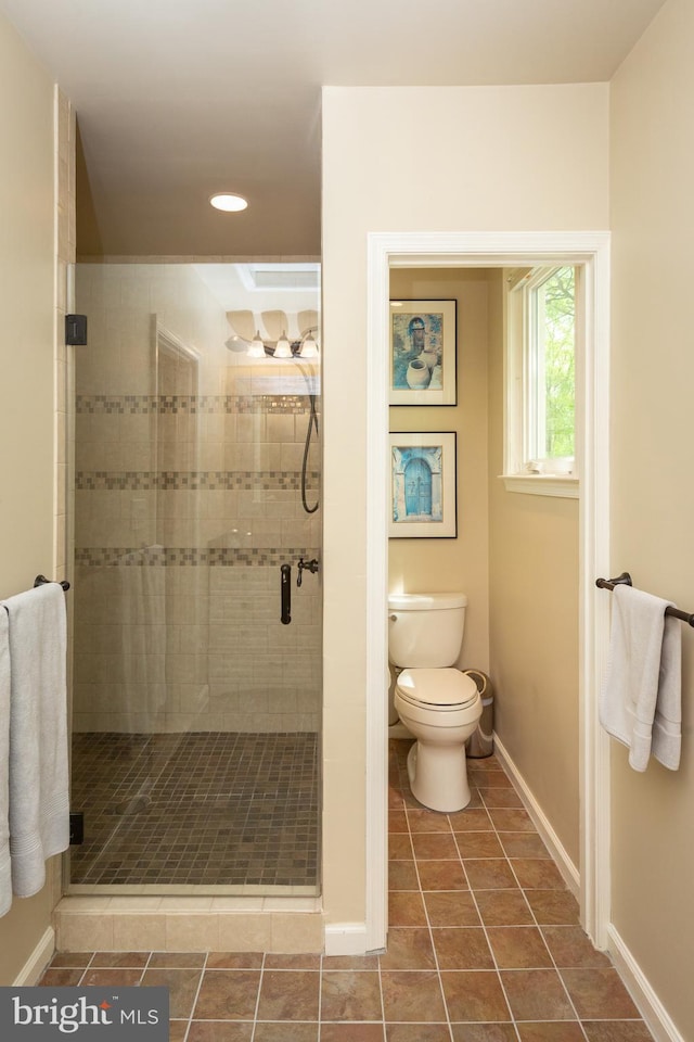 bathroom featuring toilet, tile patterned floors, recessed lighting, baseboards, and a stall shower