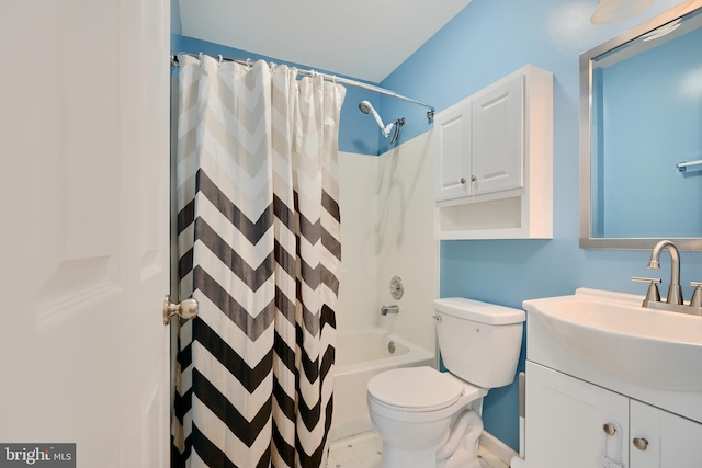 bathroom with toilet, shower / bath combo, and vanity