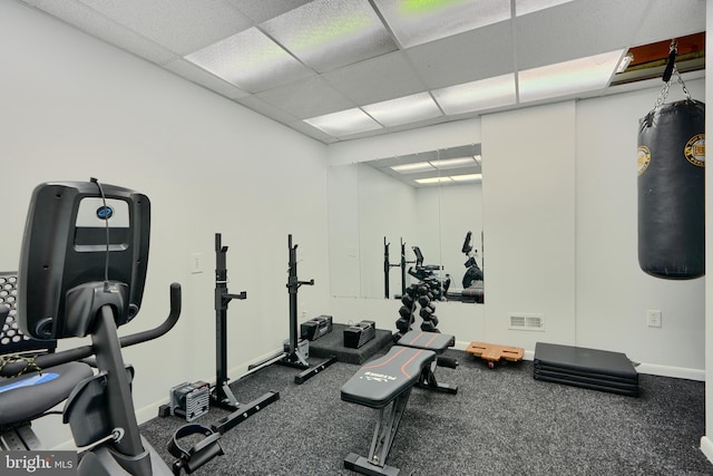 workout area with visible vents and a drop ceiling