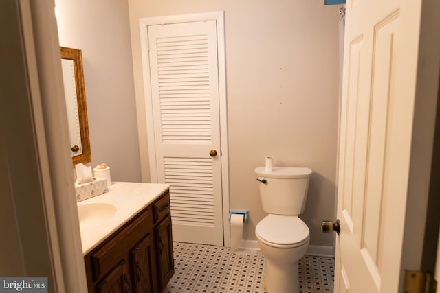 403 Leslie Ln, West Chester, PA 19382 - half bathroom featuring vanity, toilet, and tile patterned floors