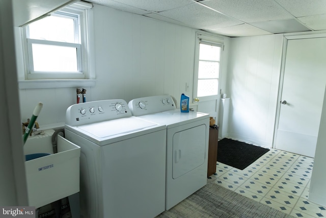 403 Leslie Ln, West Chester, PA 19382 - laundry area featuring washer and clothes dryer, light flooring, and a decorative wall