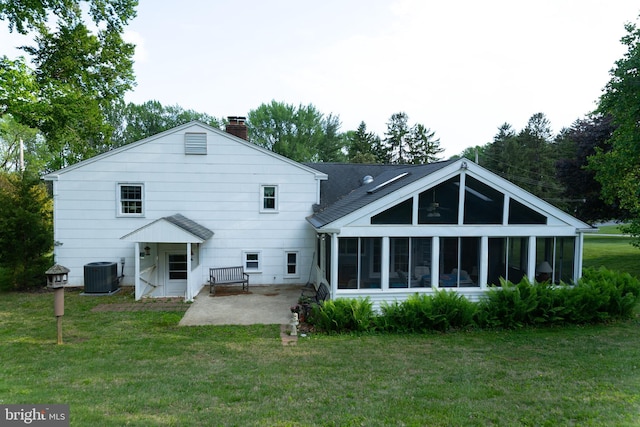 403 Leslie Ln, West Chester, PA 19382 - back of house with a patio area, a sunroom, a yard, a chimney, and central AC