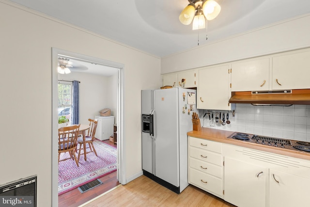 2385 Heide Cooper Rd, Shanks, WV 26761 - kitchen featuring washer / dryer, under cabinet range hood, stovetop with downdraft, a ceiling fan, and white fridge with ice dispenser