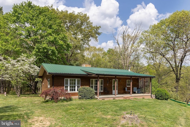 2385 Heide Cooper Rd, Shanks, WV 26761 - back of house with a chimney, a yard, a porch, and metal roof