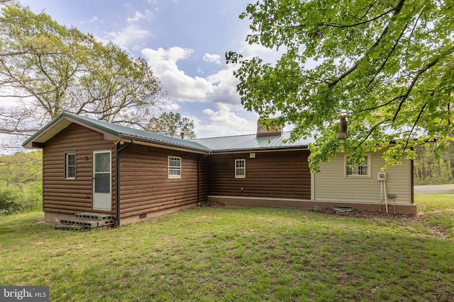 2385 Heide Cooper Rd, Shanks, WV 26761 - rear view of house with entry steps, a yard, metal roof, and crawl space