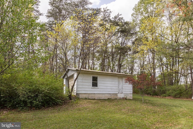 2385 Heide Cooper Rd, Shanks, WV 26761 - view of side of home with a lawn and an outdoor structure