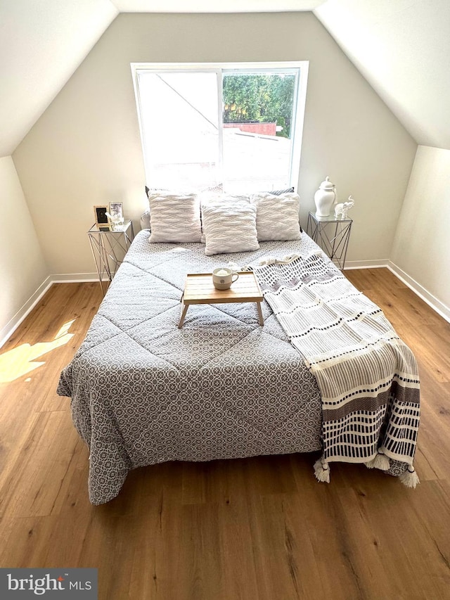 3724 Cedar Dr, Baltimore, MD 21207 - bedroom featuring vaulted ceiling, baseboards, and wood finished floors