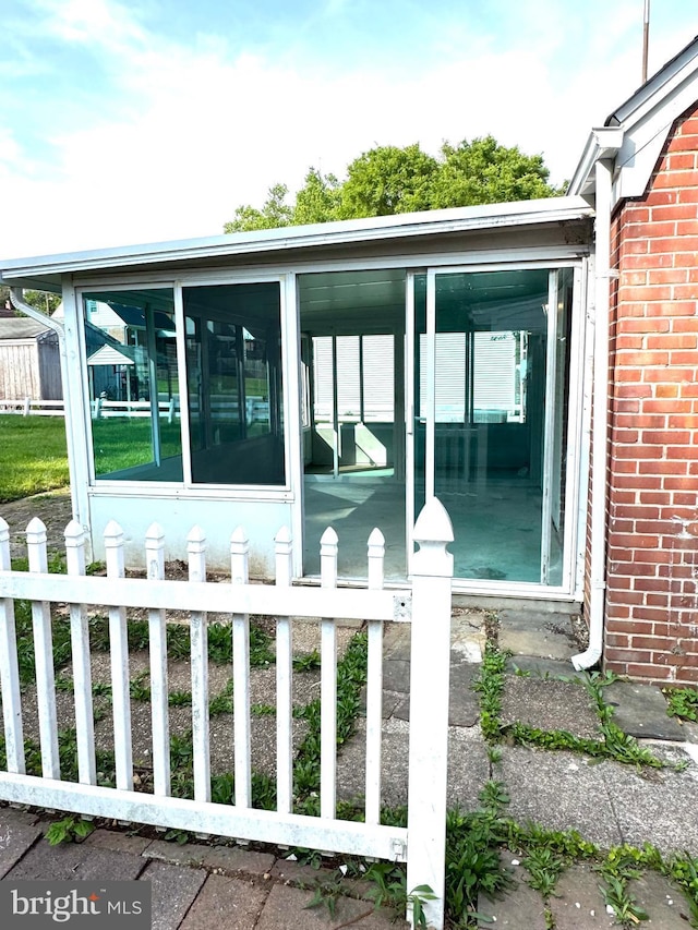 3724 Cedar Dr, Baltimore, MD 21207 - view of home's exterior with a sunroom and brick siding