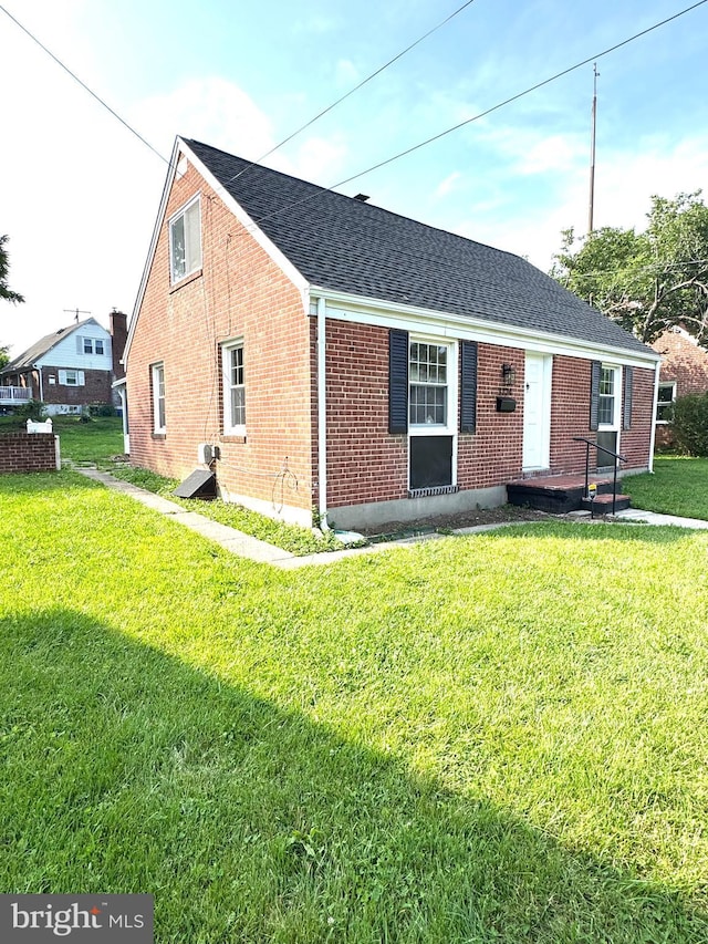 3724 Cedar Dr, Baltimore, MD 21207 - back of house with brick siding, a shingled roof, and a yard