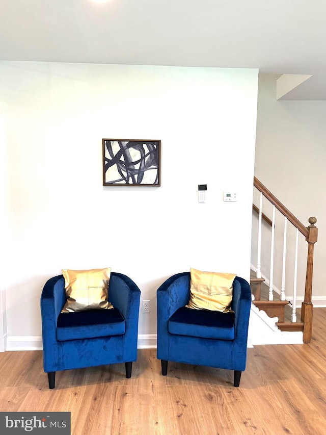 3724 Cedar Dr, Baltimore, MD 21207 - living area featuring baseboards, wood finished floors, and stairs