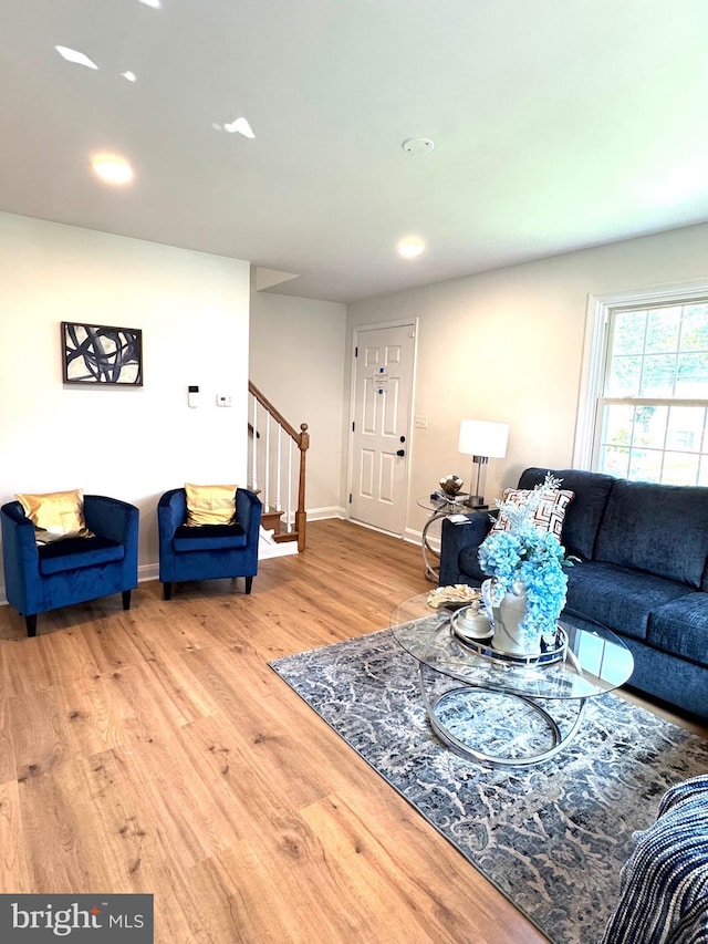 3724 Cedar Dr, Baltimore, MD 21207 - living room featuring stairs, wood finished floors, recessed lighting, and baseboards