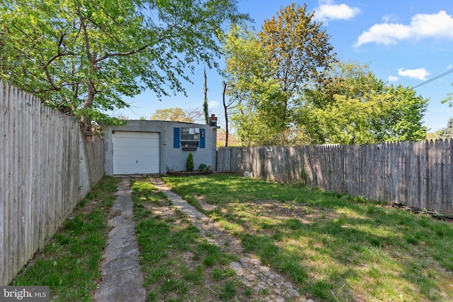 view of yard featuring a fenced backyard and driveway