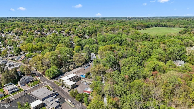 drone / aerial view featuring a forest view
