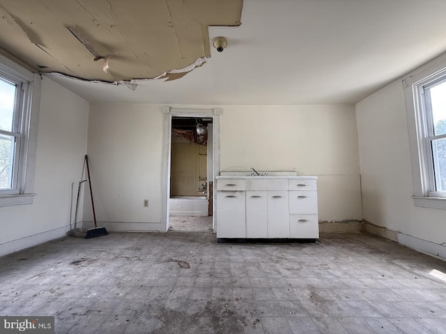 unfurnished bedroom with baseboards