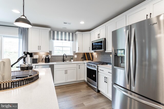 HOMESITE12 Old York Rd, Dillsburg, PA 17019 - kitchen featuring white cabinets, appliances with stainless steel finishes, light countertops, and a sink