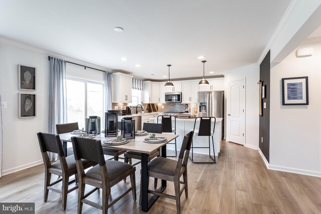 HOMESITE12 Old York Rd, Dillsburg, PA 17019 - dining area with light wood-style flooring, recessed lighting, ornamental molding, and baseboards