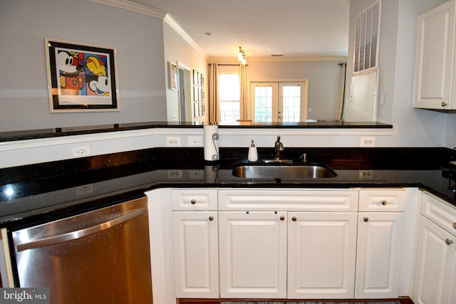 3009 Nicosh Cir Unit 4201, Falls Church, VA 22042 - kitchen featuring stainless steel dishwasher, a sink, dark stone countertops, ornamental molding, and white cabinetry