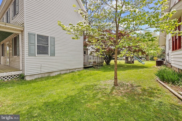 112 Walnut St, Church Hill, MD 21623 - view of yard featuring a deck, a playground, and central AC unit